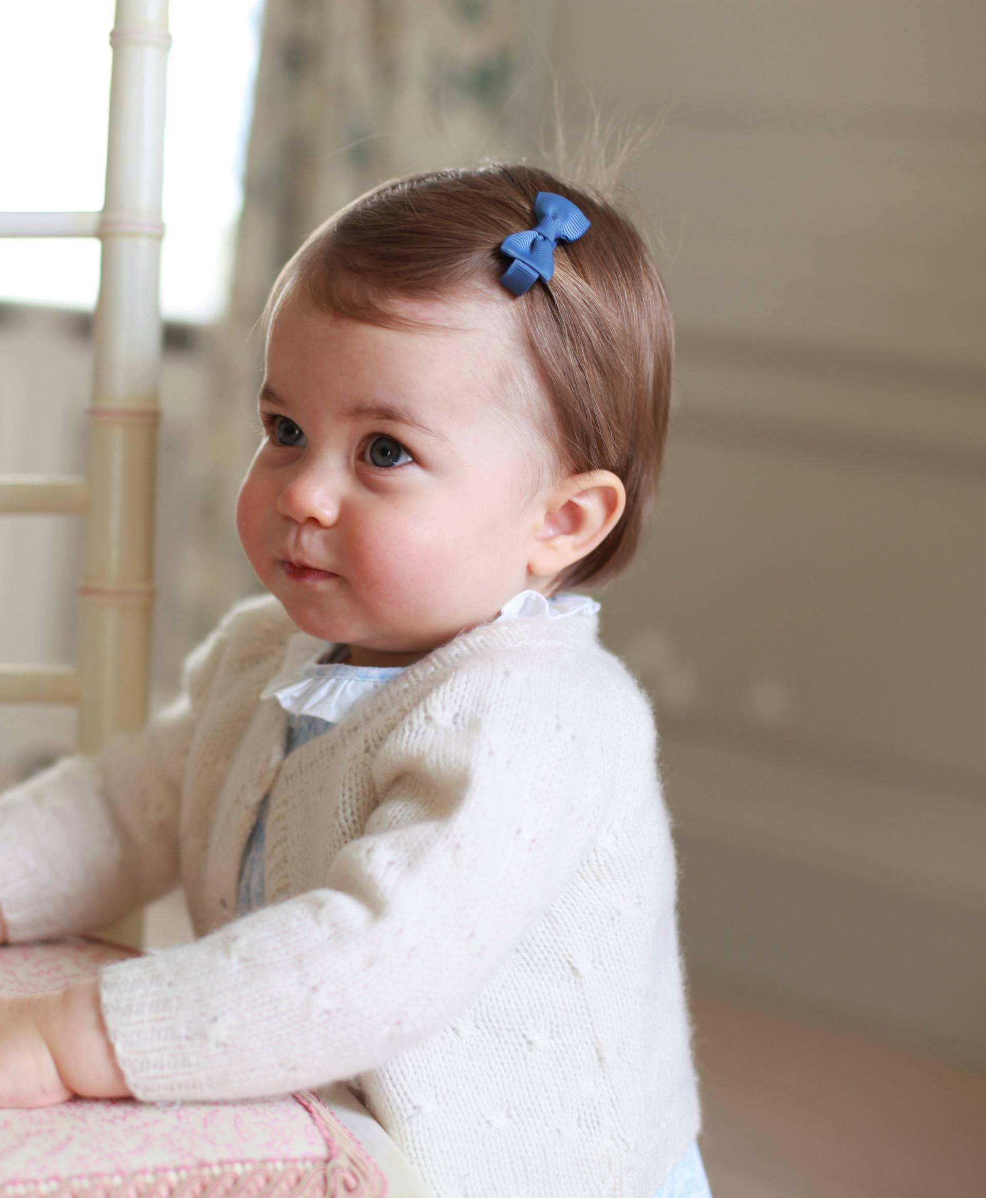 Britain's Princess Charlotte poses for a photograph in this undated photograph taken by her mother, Catherine, Duchess of Cambridge, at Anmer Hall in Norfolk