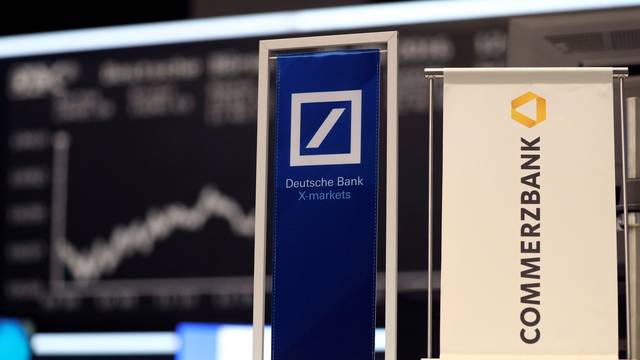 FILE PHOTO: FILE PHOTO: Banners of Deutsche Bank and Commerzbank are pictured in front of the German share price index, DAX in Frankfurt