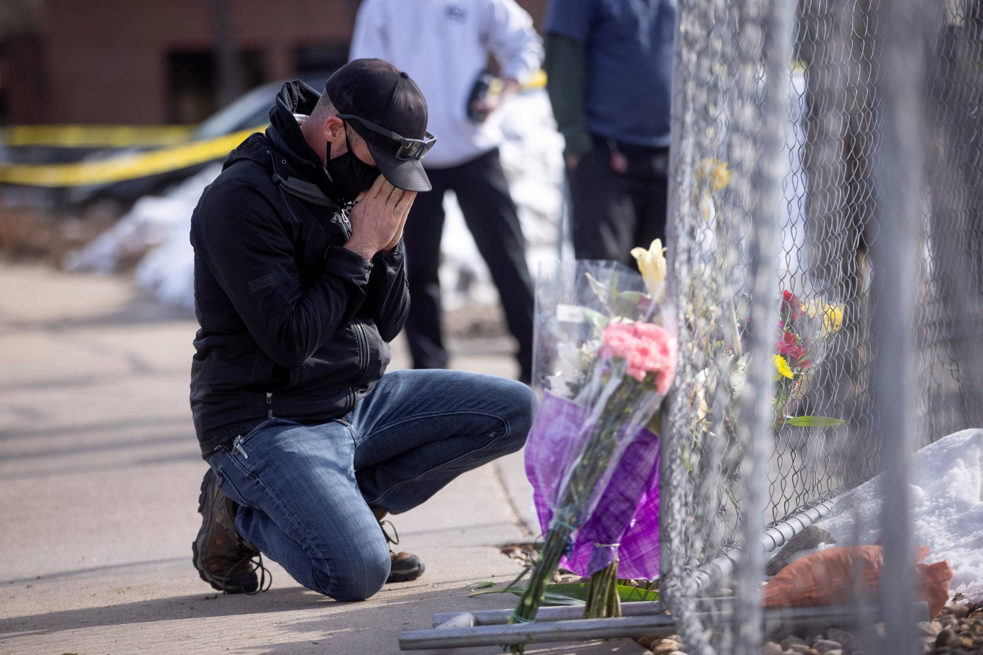 Flowers at the site of a mass shooting at King Soopers grocery store in Boulder