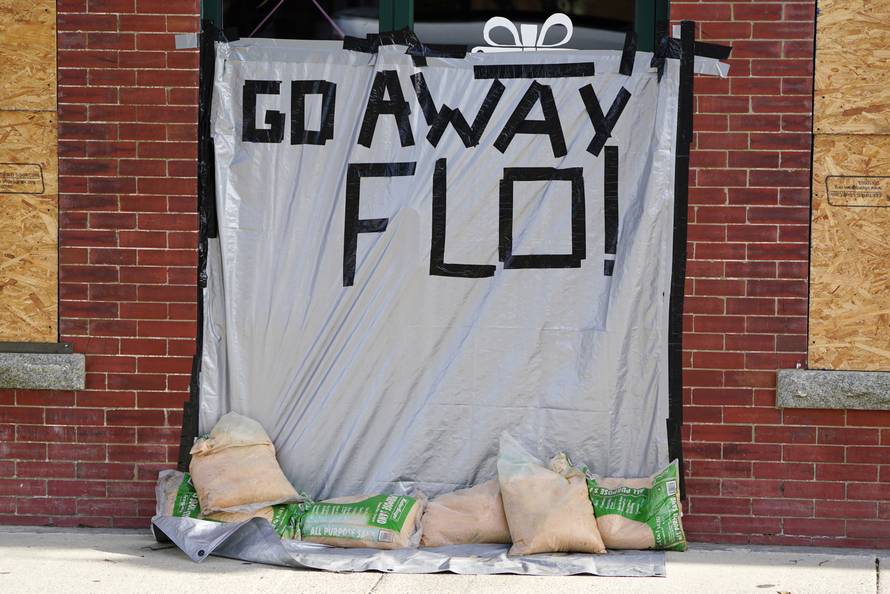 A message is posted on a boarded up building before the arrival of Hurricane Florence on Oak Island