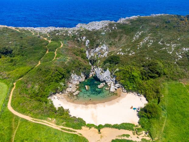 Aerial view, Playa de Gulpiyuri, flooded sinkhole with inland be