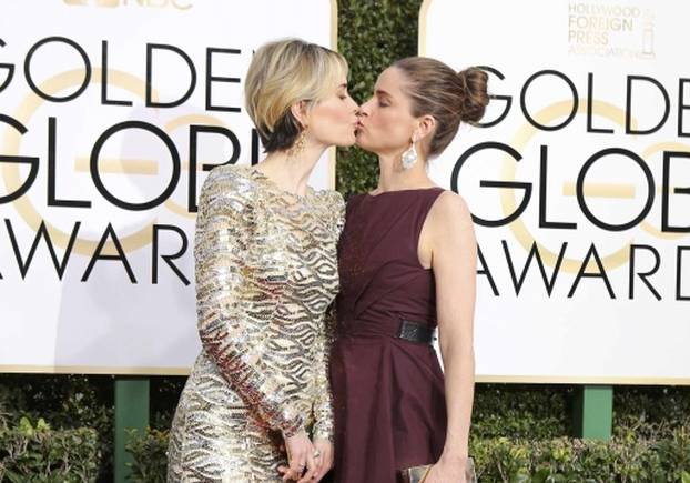 Actresses Paulson and Peet arrive at the 74th Annual Golden Globe Awards in Beverly Hills