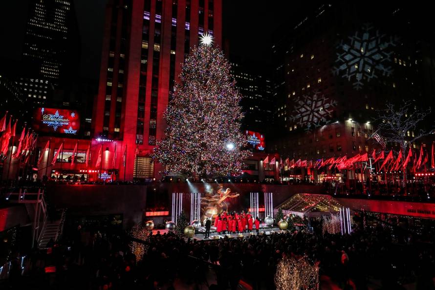 People watch the lighting of The Rockefeller Center Christmas Tree in New York City