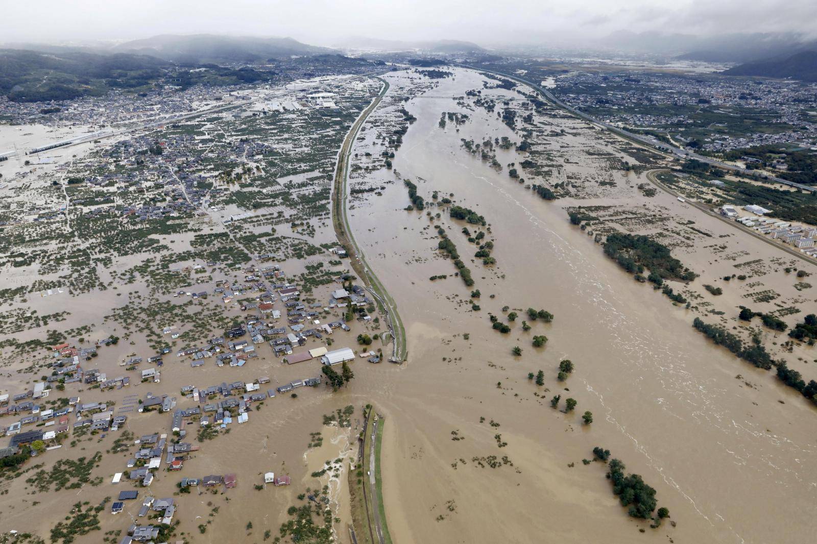 An aerial view shows residential areas flooded by the Chikuma river following Typhoon Hagibis in Nagano