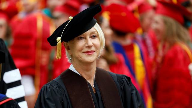 Actor Helen Mirren walks before receiving an honorary degree during the commencement ceremony at the University of Southern California (USC) in Los Angeles