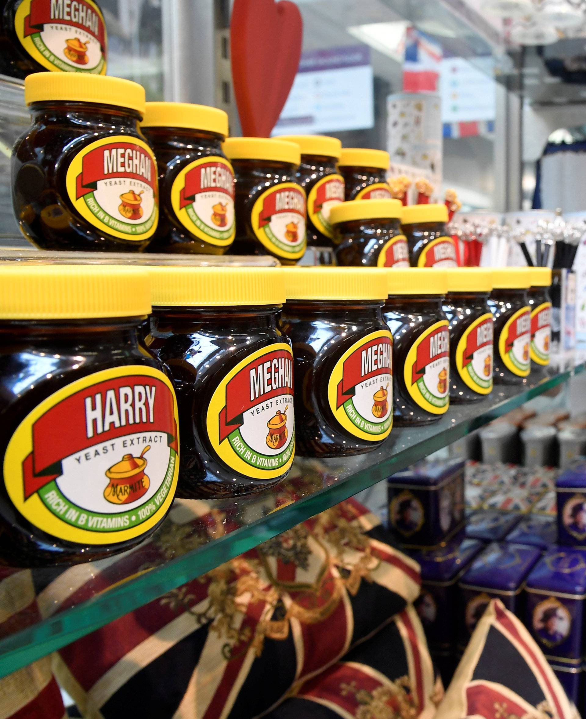 A woman browses near a shelf display with Marmite spread with a redesigned label for the forthcoming wedding of Britain's Prince Harry and his fiancee Meghan Markle in Windsor, Britain