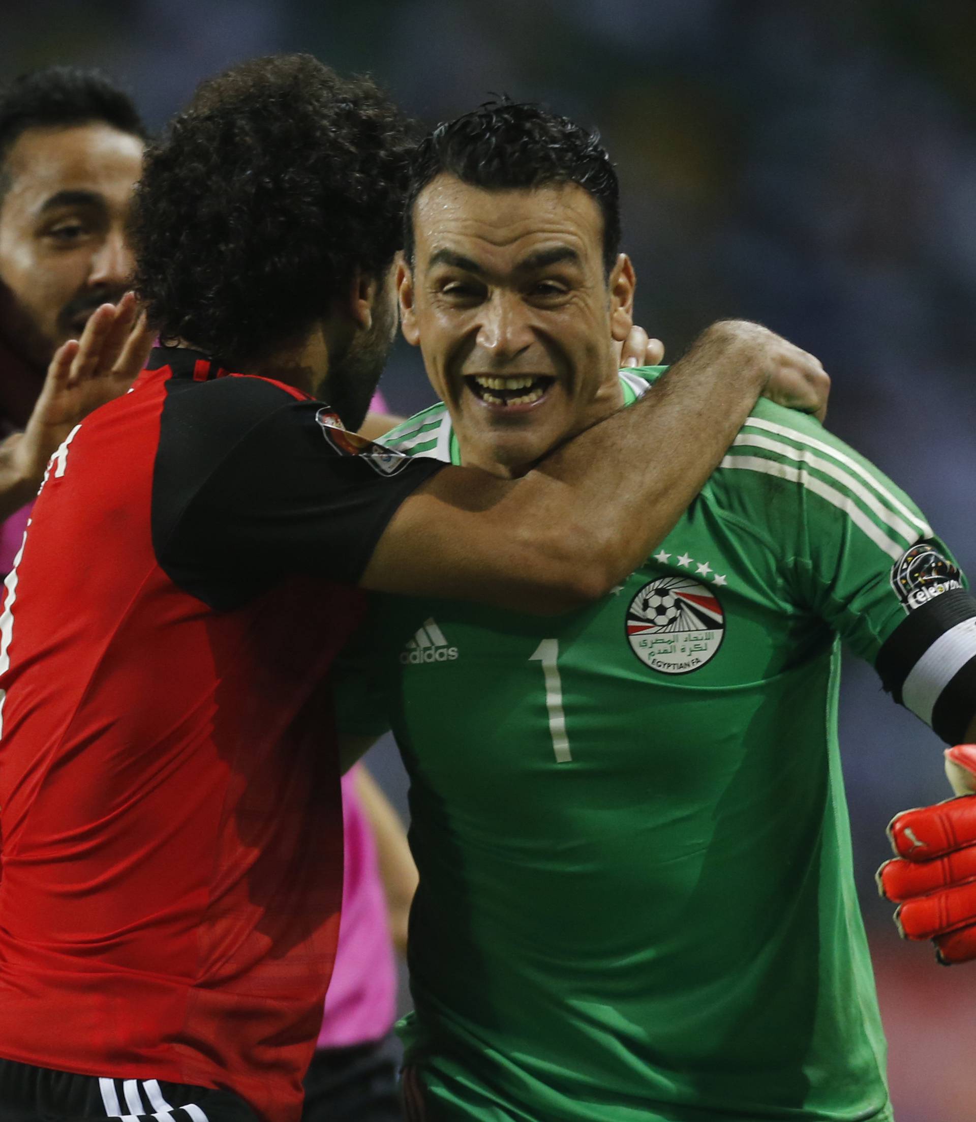 Egypt's Essam El-Hadary celebrates with team mates after the game