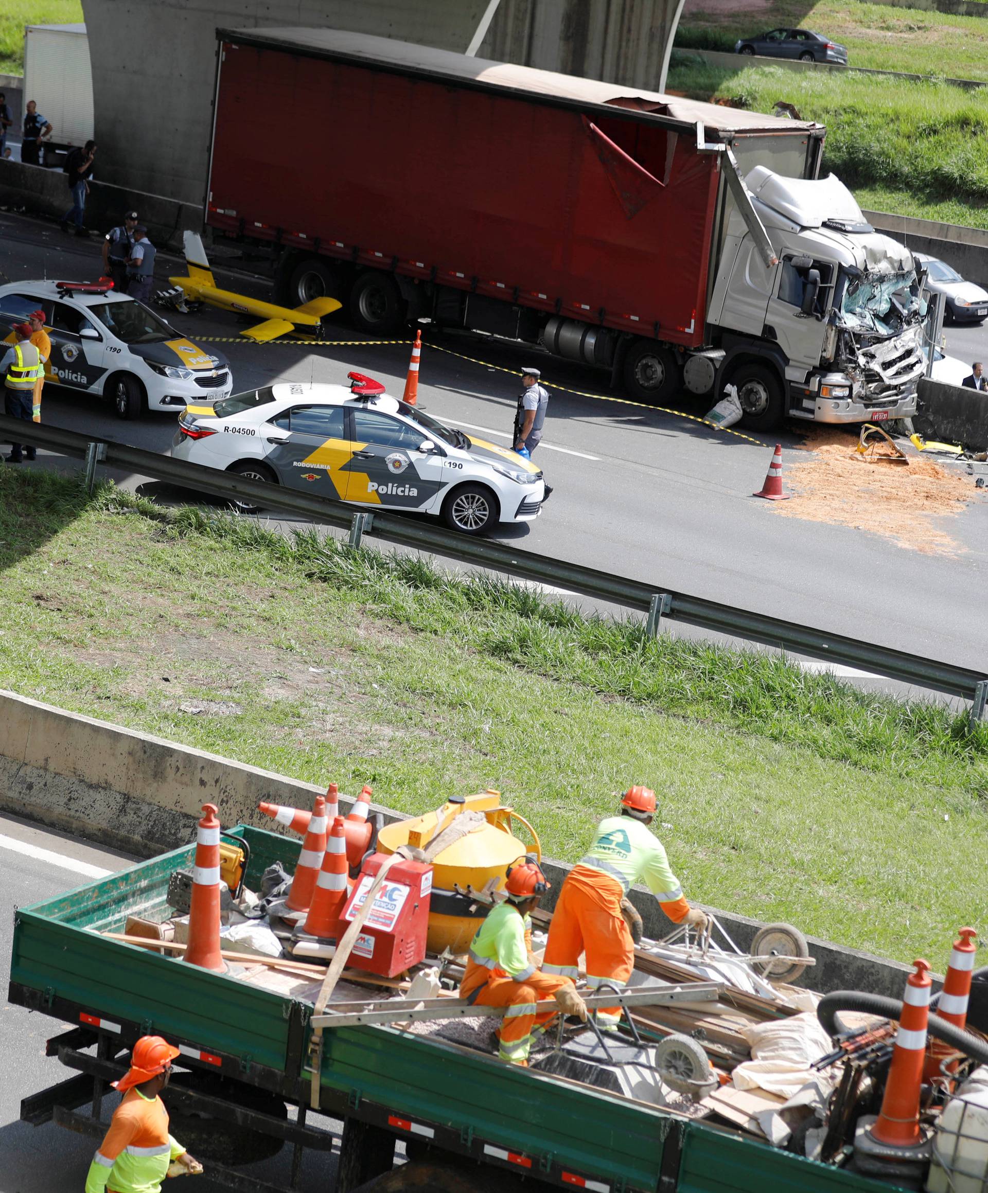 Wreckage of a helicopter and a truck that have crashed are seen on Anhanguera Highway, in Sao Paulo