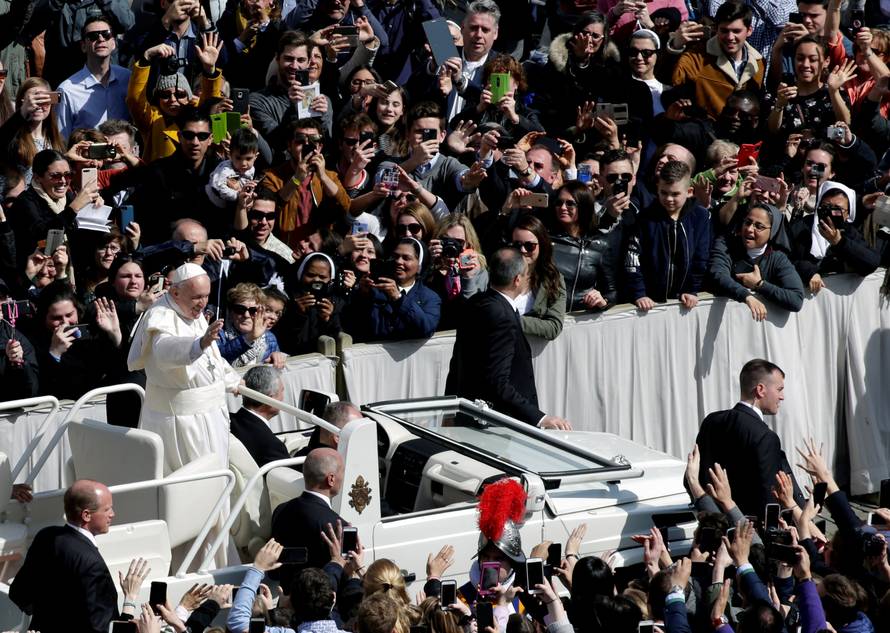 Pope Francis waves from his Papamobile after the Easter Mass at St. Peter's Square at the Vatican