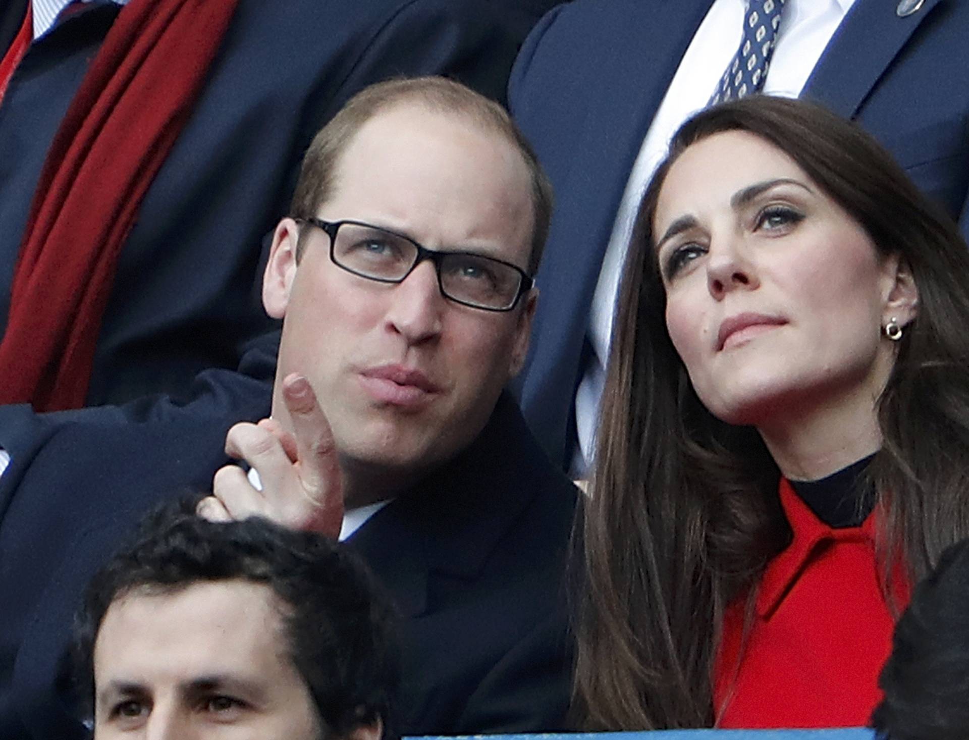Britain's Catherine the Duchess of Cambridge and Prince William attend the Six Nations Championship match between France and Wales at the Stade de France stadium in Saint-Denis near Paris