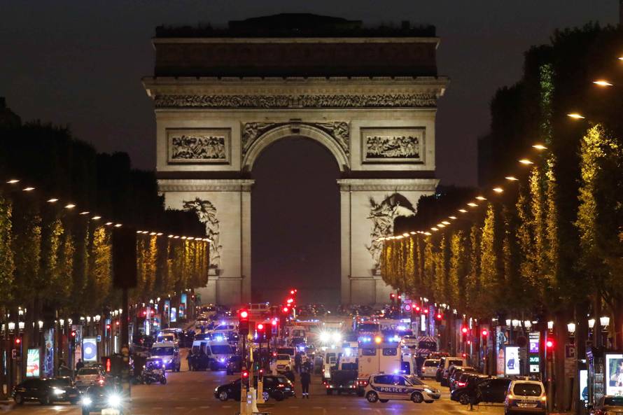 Police secure the Champs Elysees Avenue after one policeman was killed and another wounded in a shooting incident in Paris