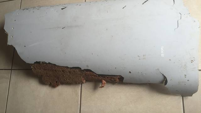 Handout photo of piece of debris found by a South African family off the Mozambique coast, which authorities will examine to see if it is from missing Malaysia Airlines flight MH370