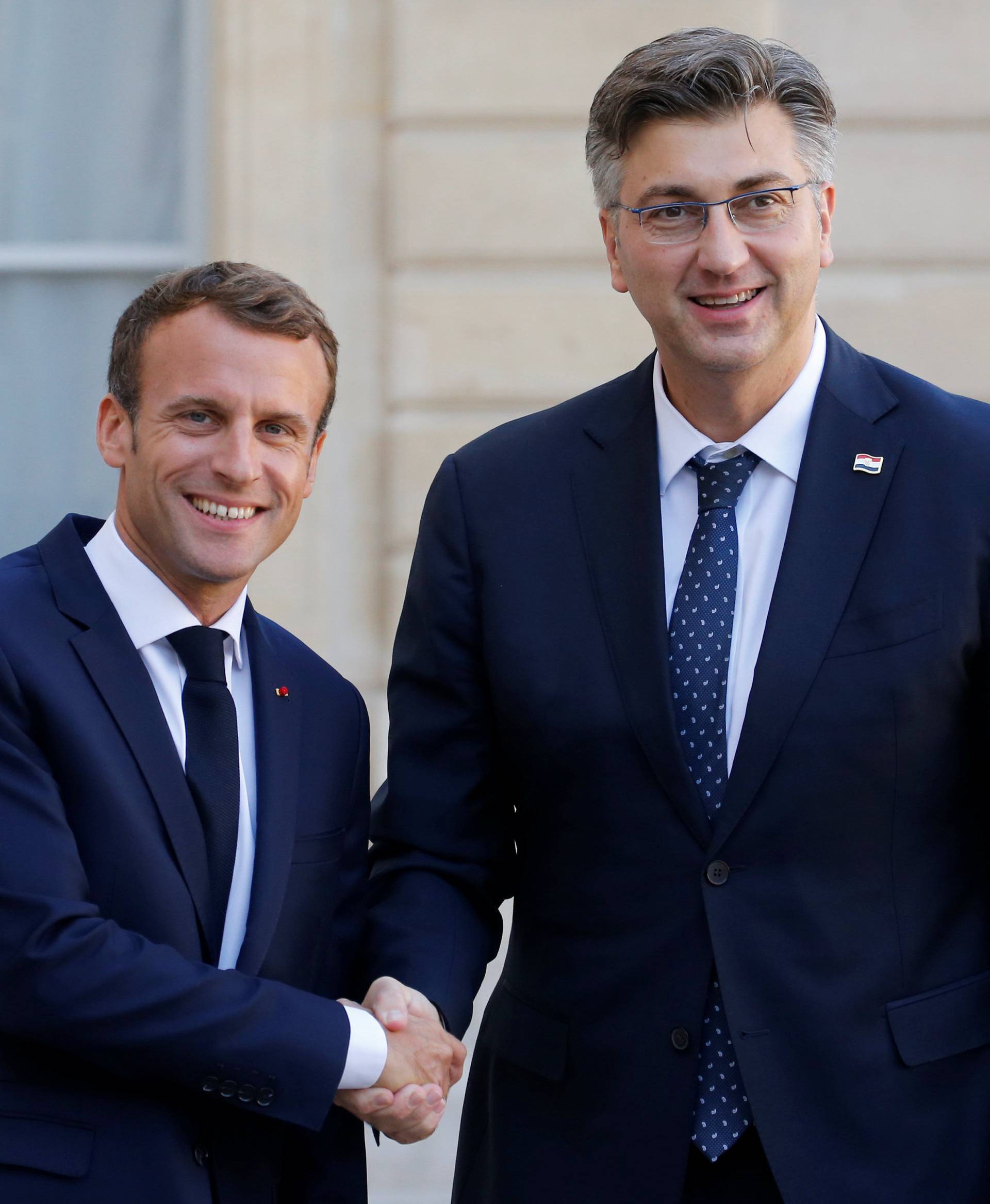 French President Emmanuel Macron welcomes Croatian Prime Minister Andrej Plenkovic at the Elysee Palace in Paris