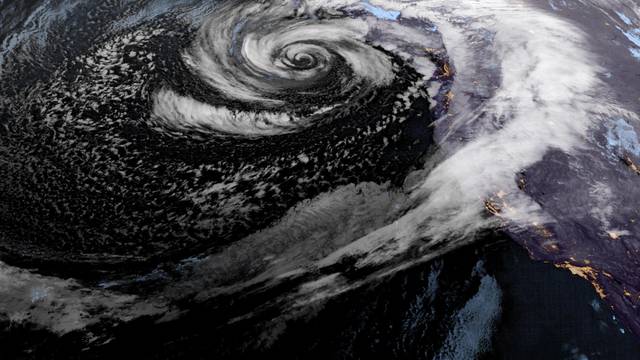 A low pressure storm system known as a "bomb cyclone" forms off the coast of the U.S. Pacific Northwest and western Canada