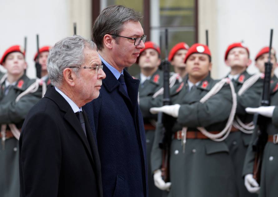 Austria's President Van der Bellen and Serbia's President Vucic review the honour guard in Vienna
