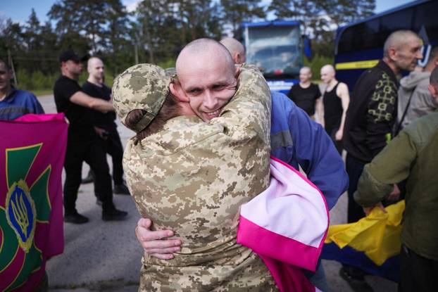 Ukrainian POWs are seen after a swap at an unknown location in Ukraine