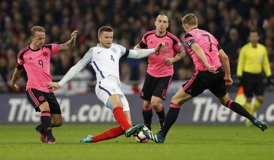 Scotland's Leigh Griffiths, Scott Brown and Darren Fletcher in action with England's Eric Dier