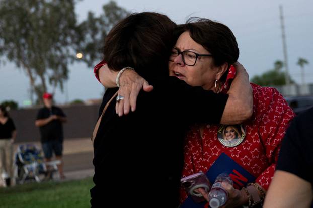 Catholics from across the Phoenix area gather to pray for Charlie Kirk, who was shot and killed in Utah, at Desert Horizon Park in Scottsdale