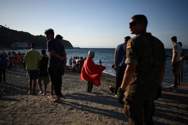 Mass crossings of migrants on foot and by sea from Morocco into Spanish territory, in Ceuta