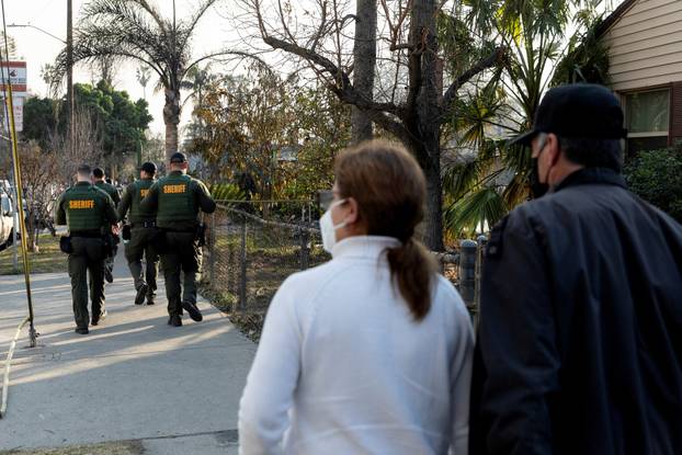 Los Angeles County Sheriff's Department officers patrol the streets affected by the Eaton Fire in Altadena