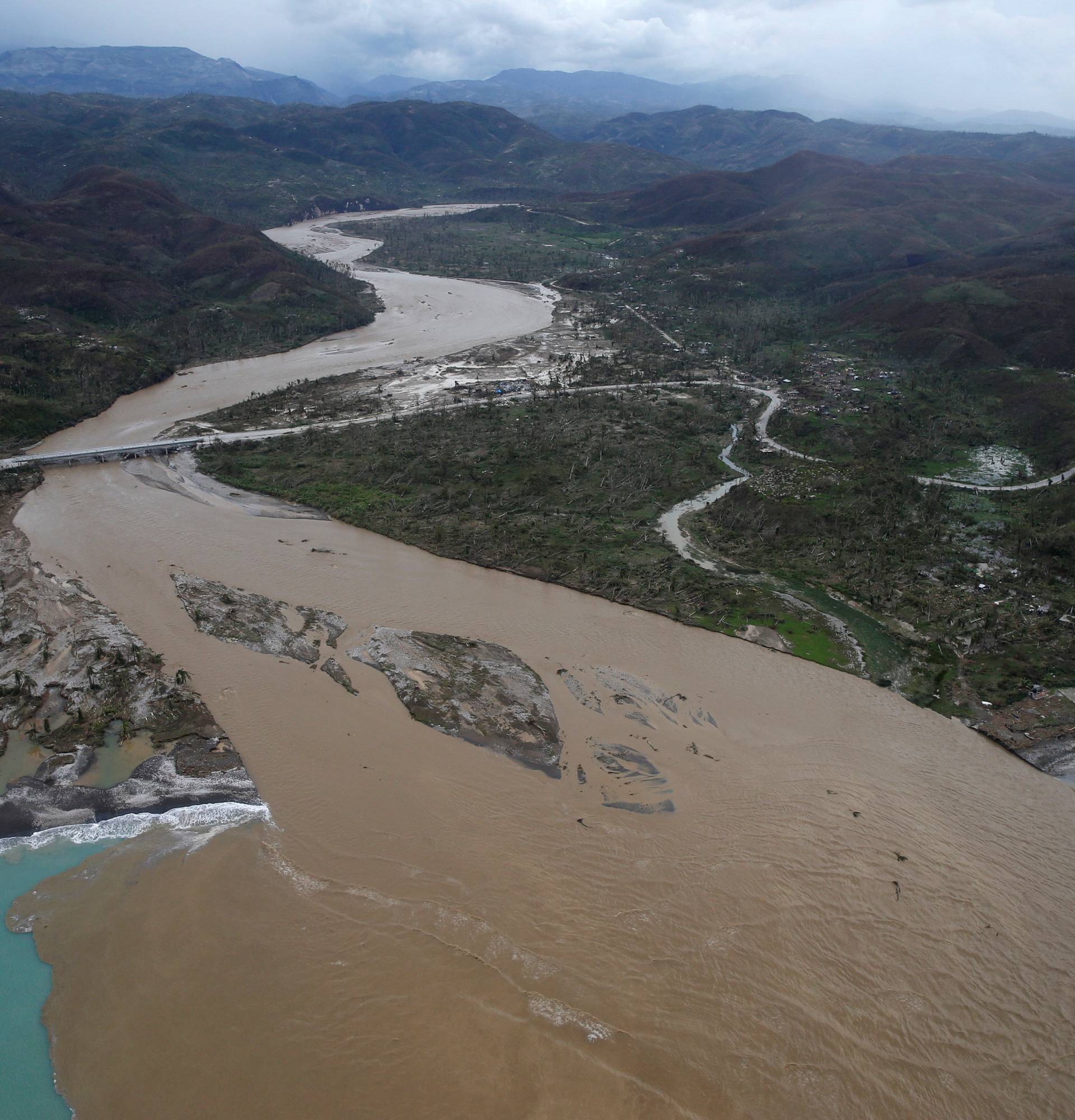 A flooded river is seen after Hurricane Matthew passes Jeremie, Haiti