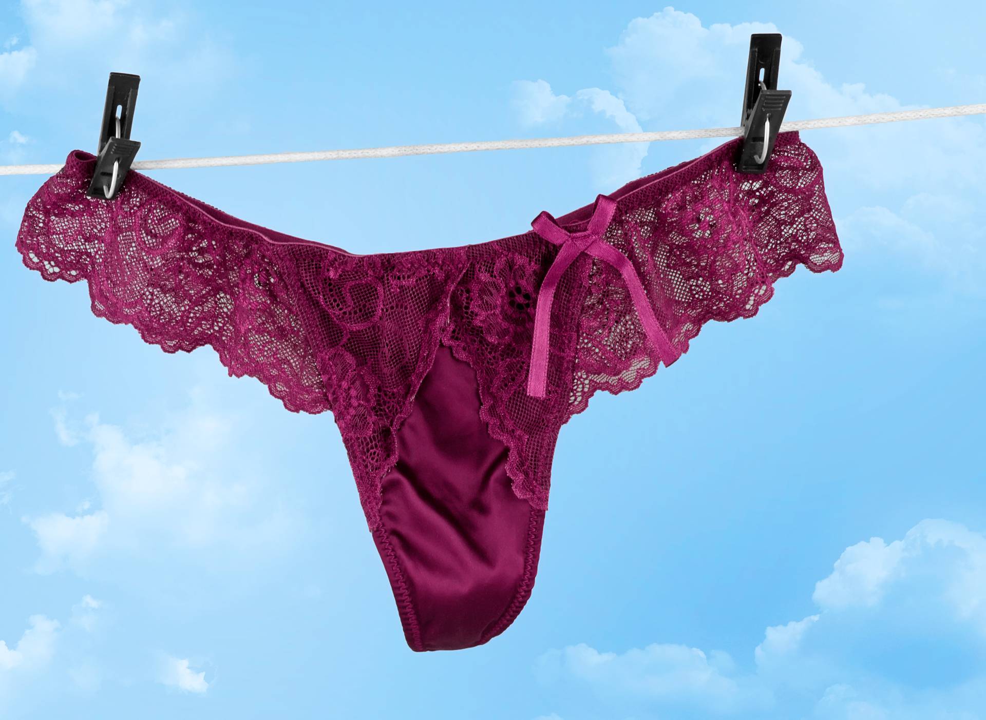 Sexy female underwear drying on rope