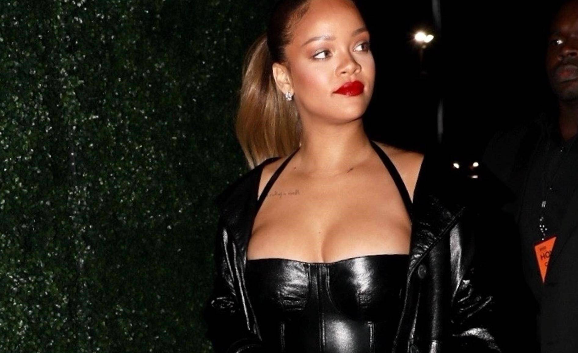 Rihanna wears a revealing little black dress to Jay-Z's show at The Forum