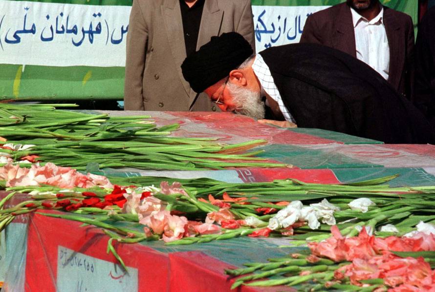 FILE PHOTO: IRAN'S SUPREME LEADER AYATOLLAH KHAMENEI KISSES COFFIN.