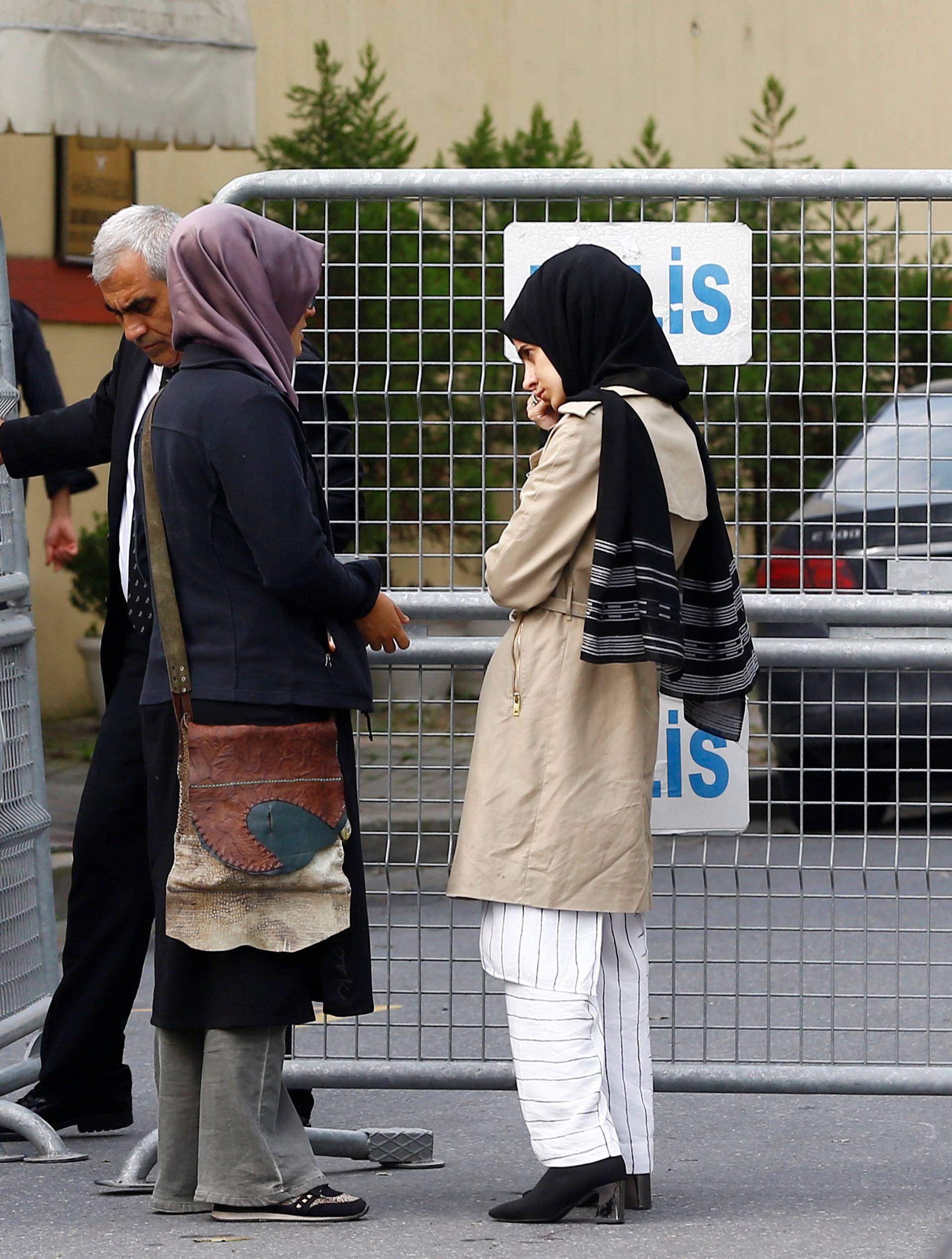 Fiancee of Saudi journalist Jamal Khashoggi and her friend wait outside Saudi Arabia's consulate in Istanbul