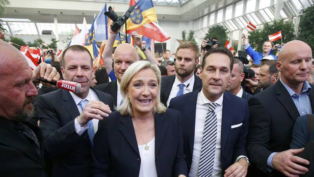 France's far right National Front political party leader Le Pen and Austrian far right FPOe leader Strache arrive at the "Public Meeting on Patriotic Spring" in Vienna