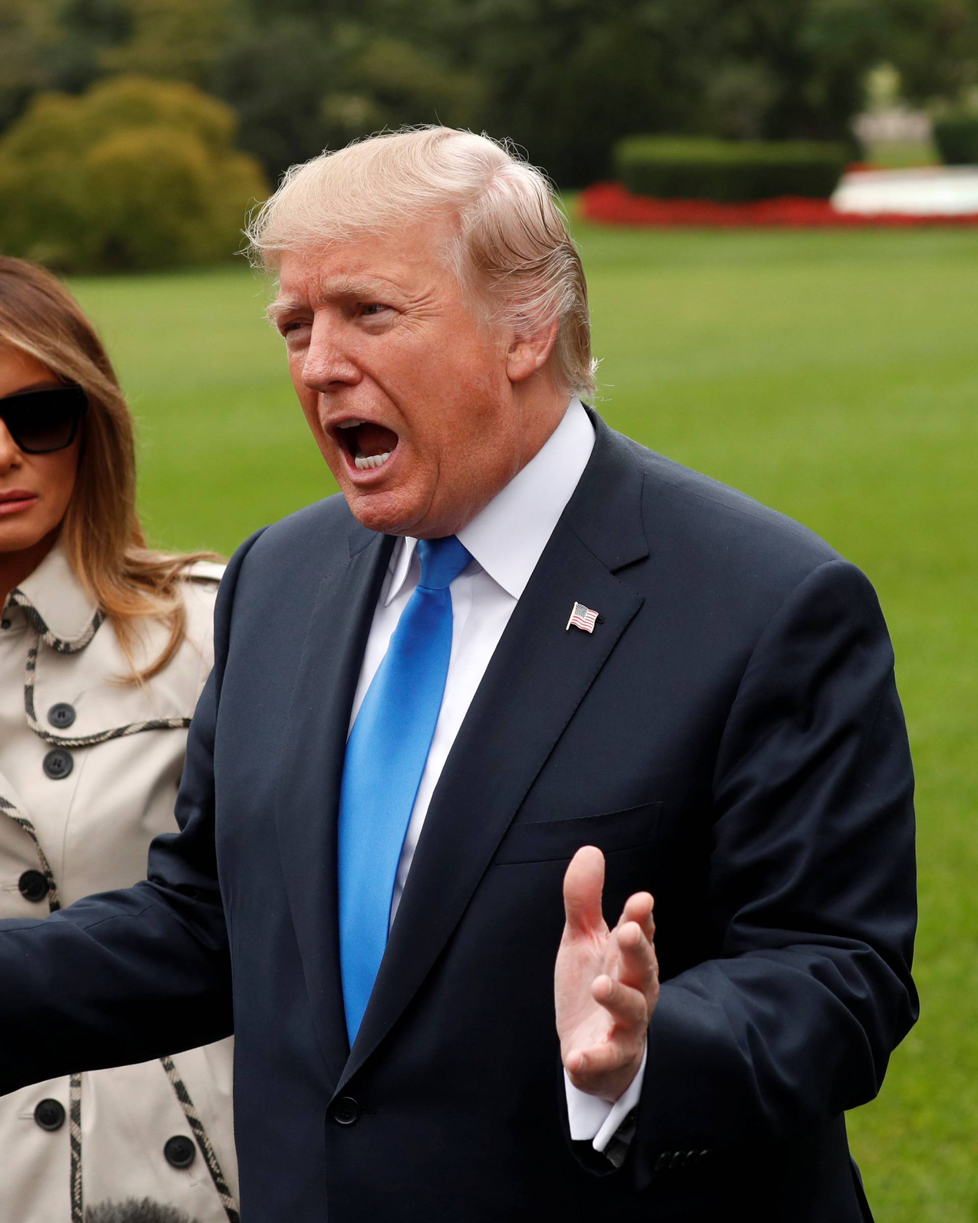 Trump speaks to reporters as he leaves the White House in Washington