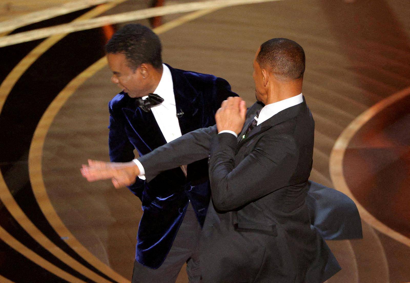 FILE PHOTO: Will Smith hits Chris Rock onstage during the 94th Academy Awards in Hollywood
