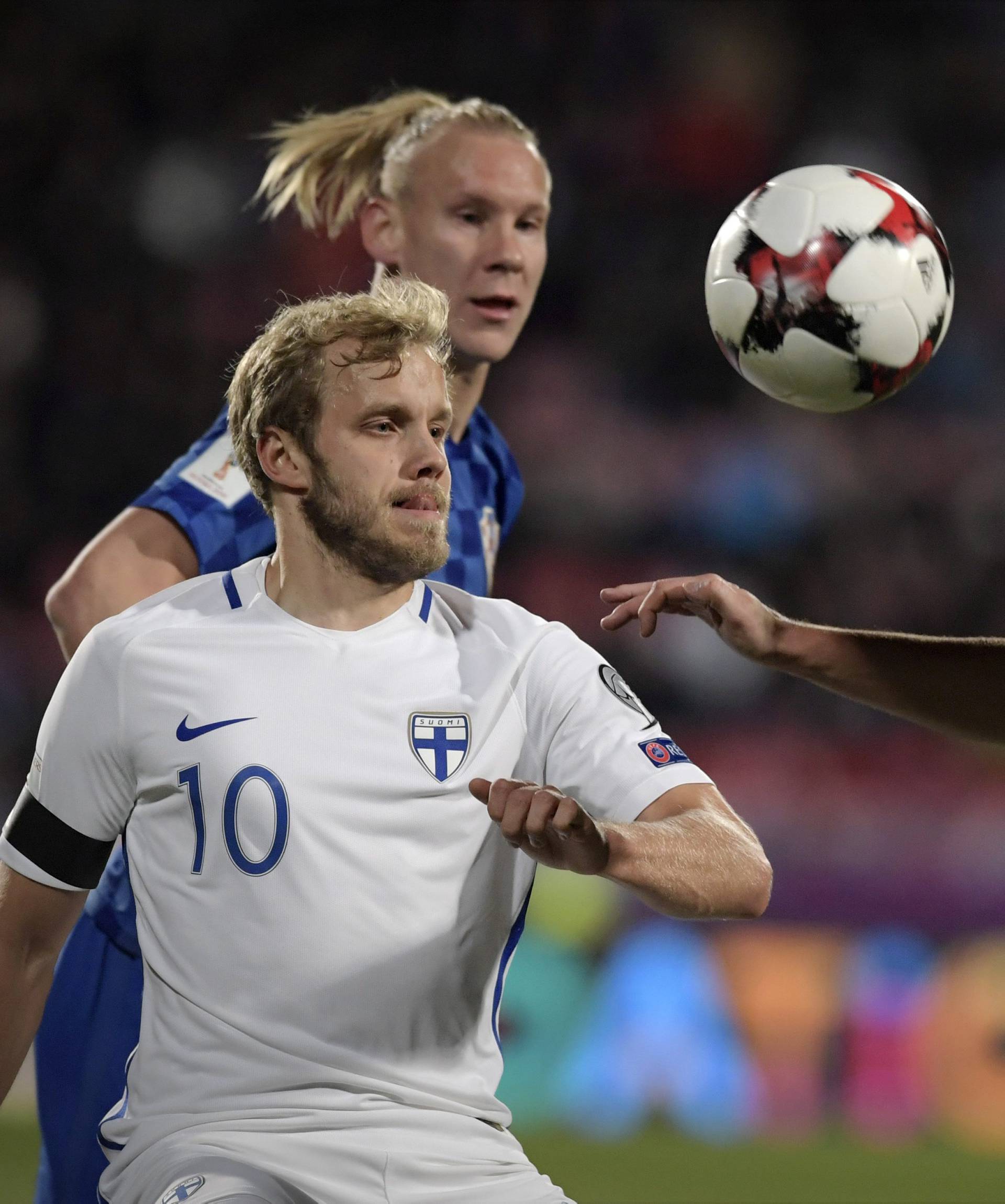 Teemu Pukki of Finland and Vida Domagoj and Matej Mitrovic of Croatia fight for the ball during the FIFA World Cup 2018 football qualification match between Finland and Croatia in Tampere