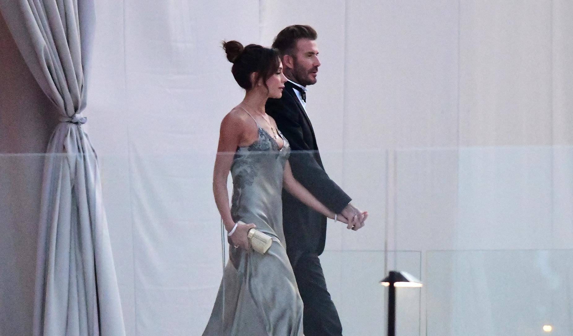 David Beckham and his wife Victoria Beckham enter the dinner tent after their son Brooklyn married Nicola Peltz in Palm Beach