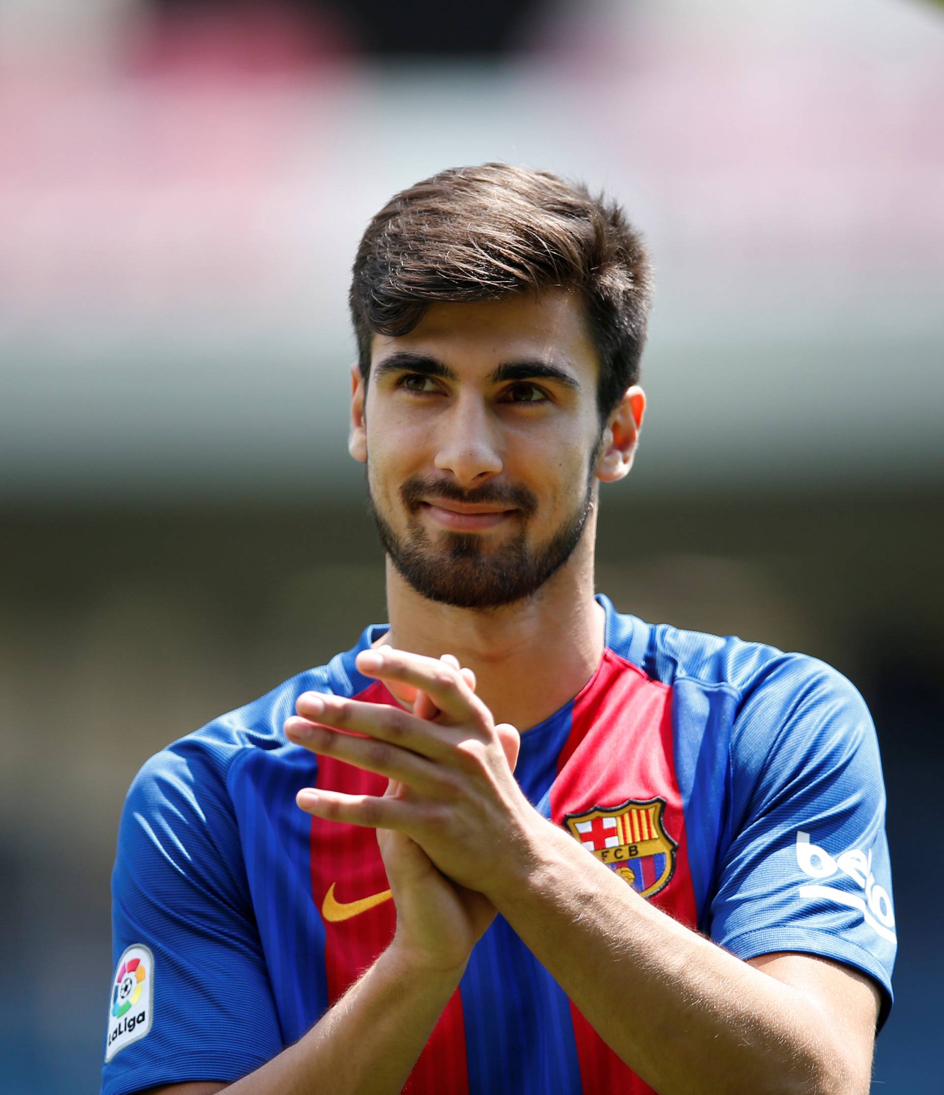 FC Barcelona's newly signed soccer player Andre Gomes claps his hands to the crowd during his presentation at Mini Estadi stadium in Barcelona