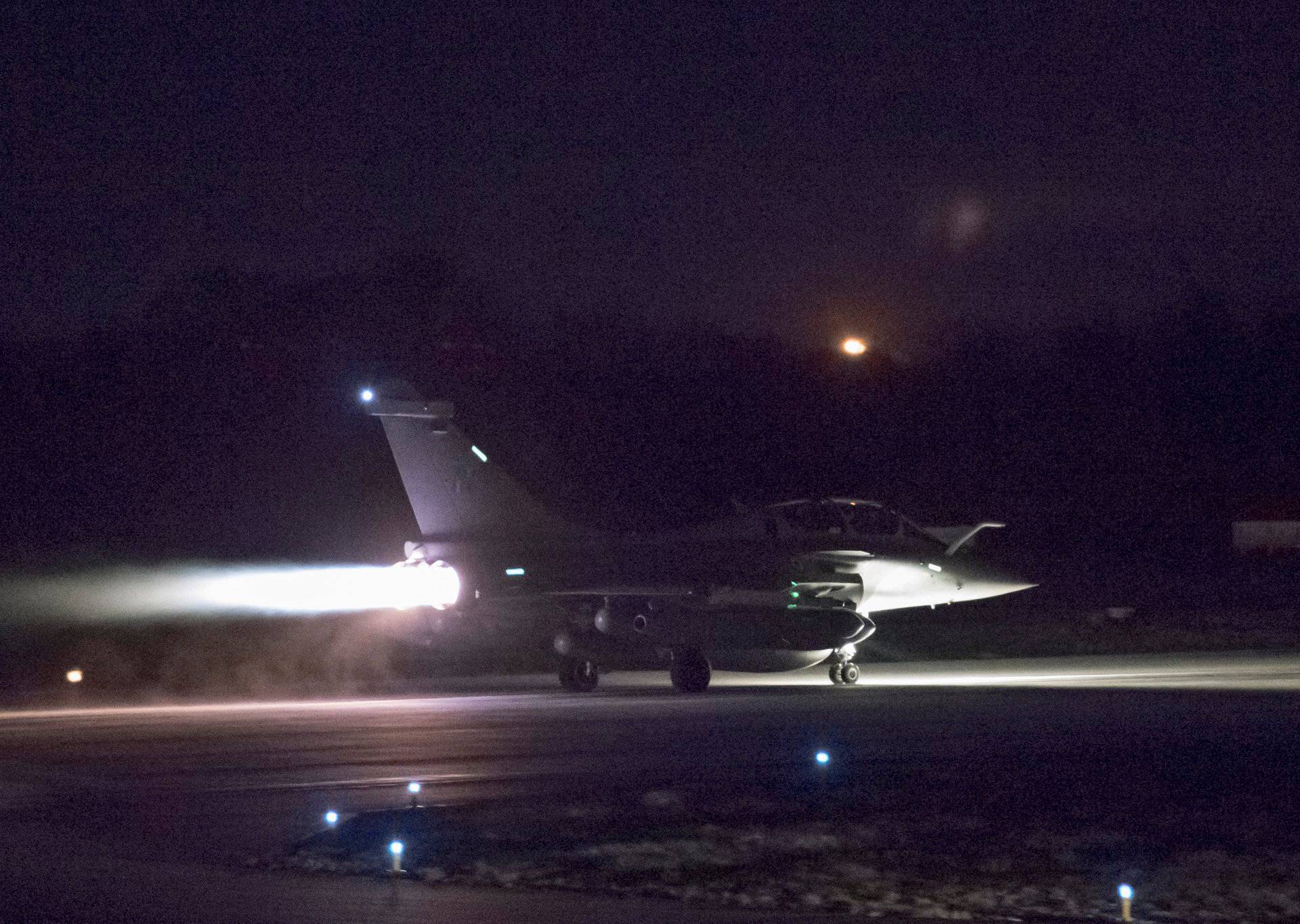 A plane preparing to take off as part of the joint airstrike operation by the British, French and U.S. militaries in Syria, is seen in this picture obtained via social media