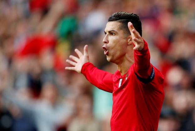FILE PHOTO: Cristiano Ronaldo celebrates the first of his three goals in Portugal