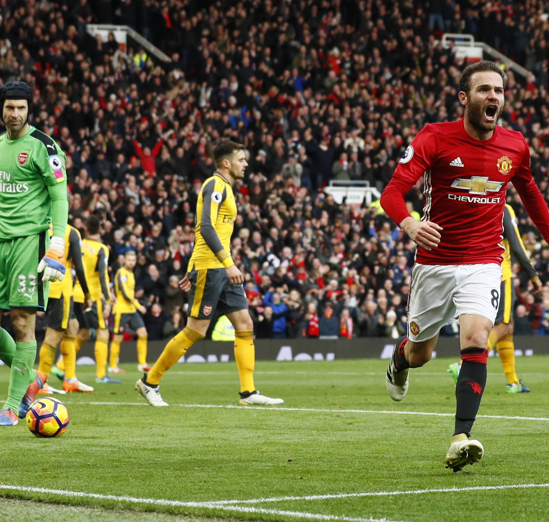 Manchester United's Juan Mata celebrates scoring their first goal