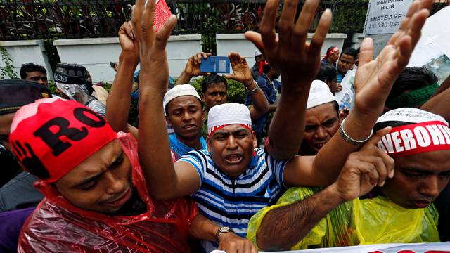 Rohingyas living in Malaysia protest against the treatment of Myanmar's Rohingya Muslims near the Myanmar embassy in Kuala Lumpur
