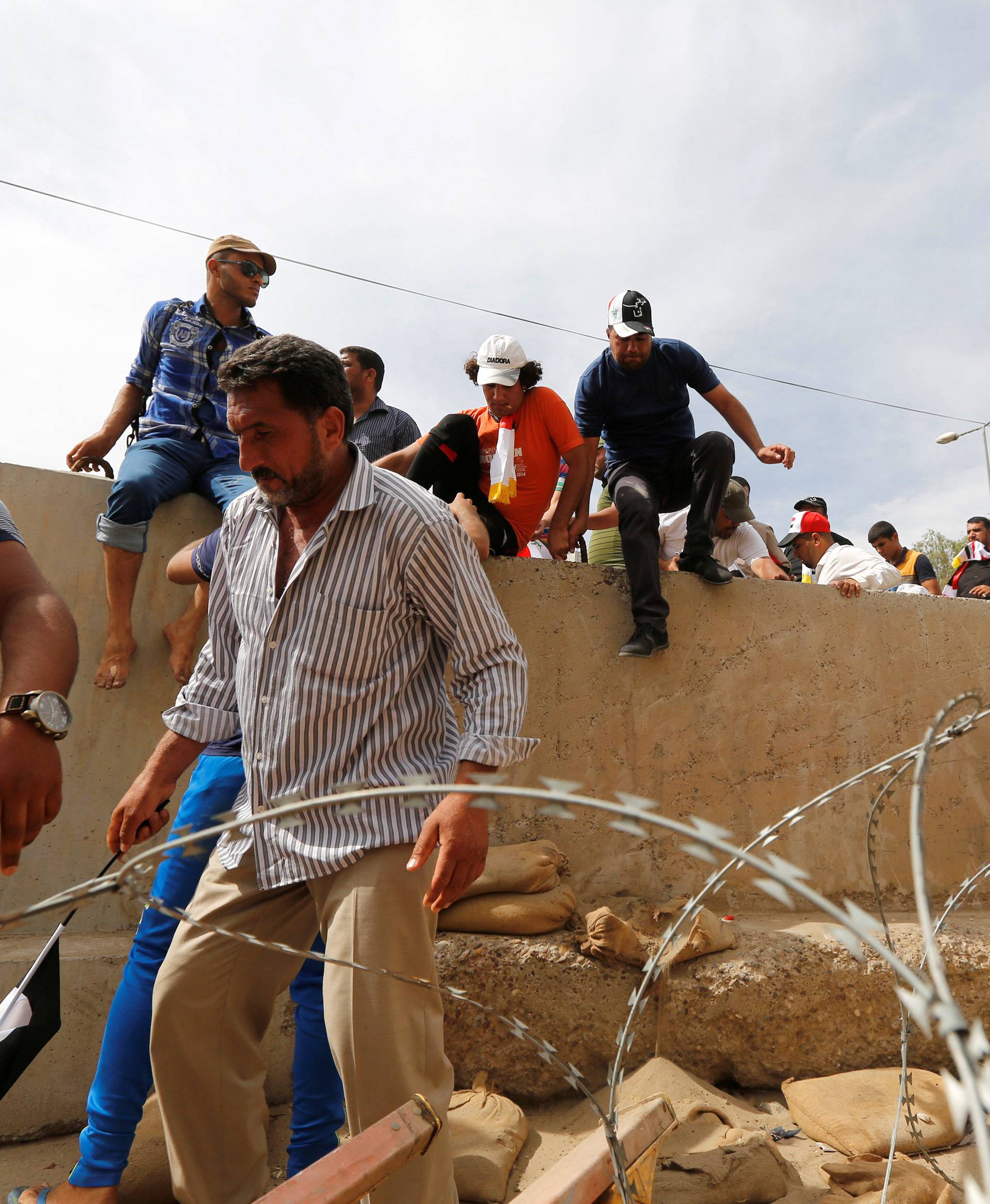 Followers of Iraq's Shi'ite cleric Moqtada al-Sadr storm Baghdad's Green Zone after lawmakers failed to convene for a vote on overhauling the government, in Iraq 