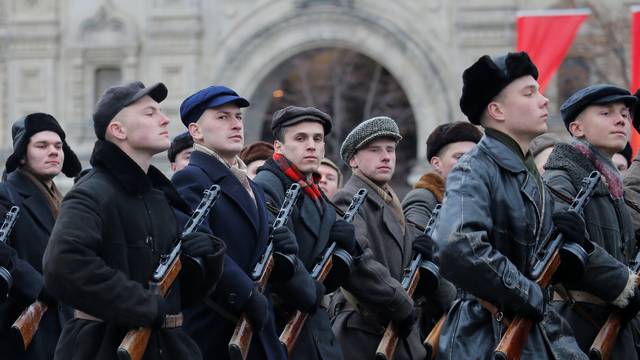 Performers dressed as militia take part in a military parade marking the anniversary of the 1941 parade, when Soviet soldiers marched towards the front lines of World War Two, in Red Square in Moscow