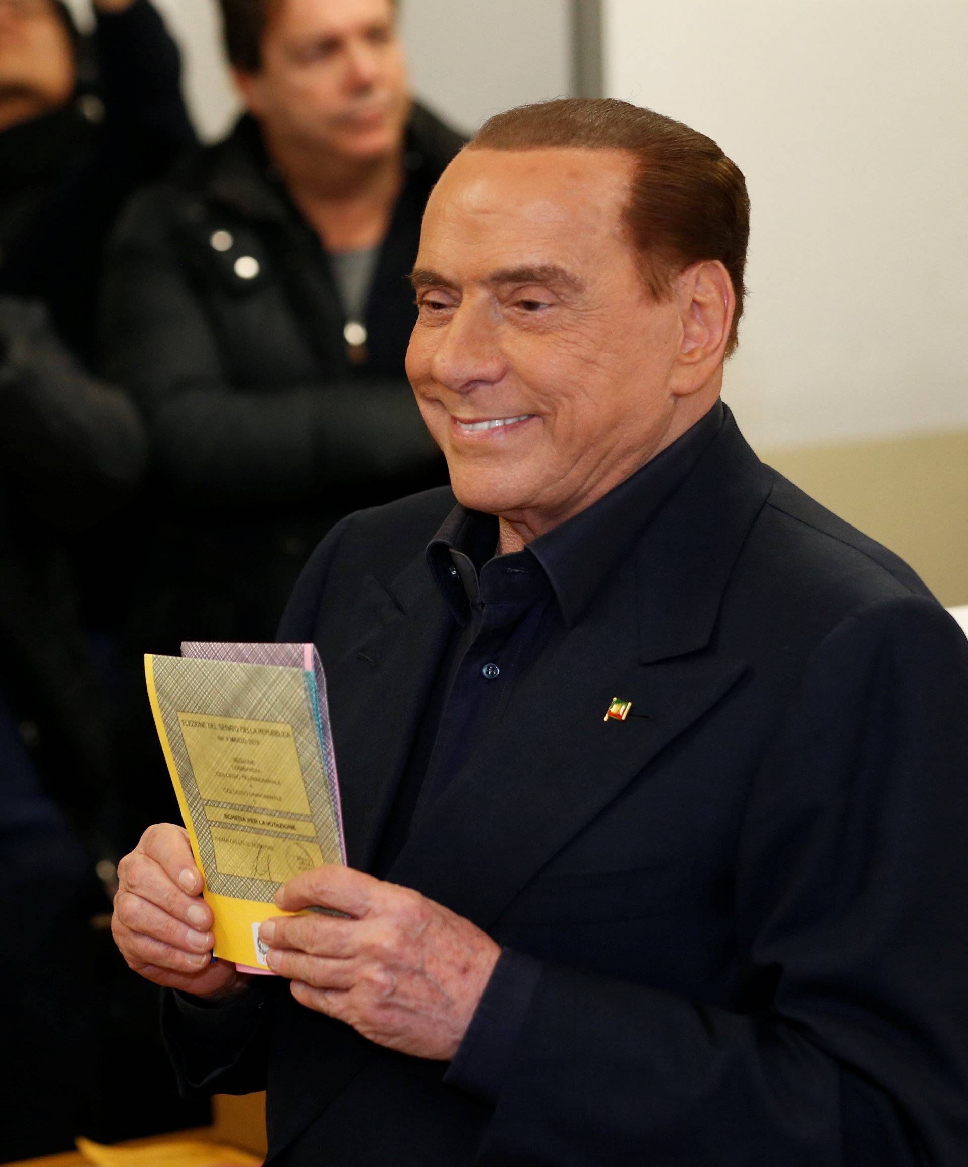 Forza Italia party leader Silvio Berlusconi casts his vote at a polling station in Milan