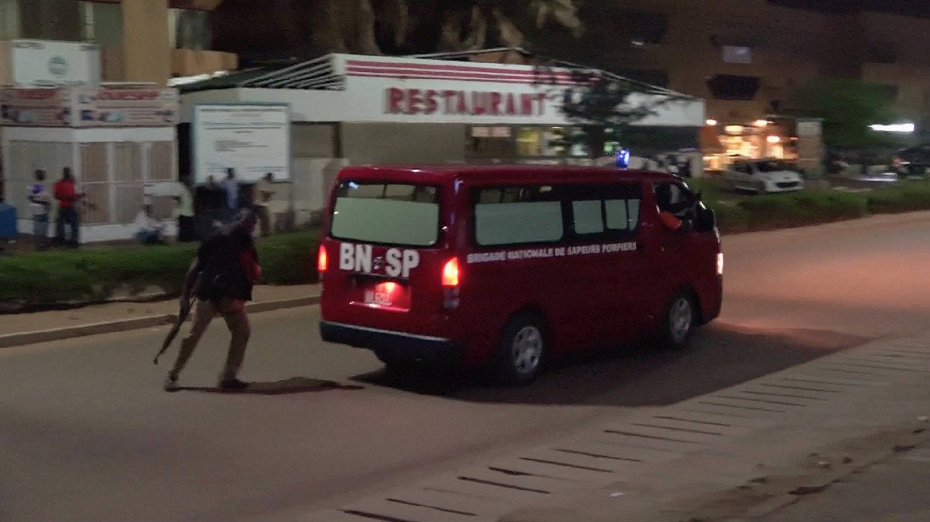 A fire brigade vehice departs following an attack by gunmen on a restaurant in Ouagadougou