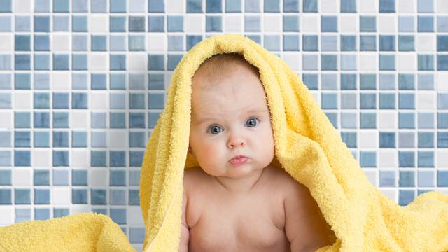 Cute baby in bath towel