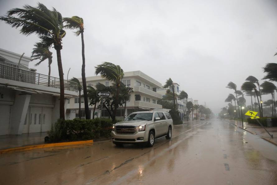 A vehicle drives along Ocean Drive in South Beach as Hurricane Irma arrives at south Florida, in Miami Beach