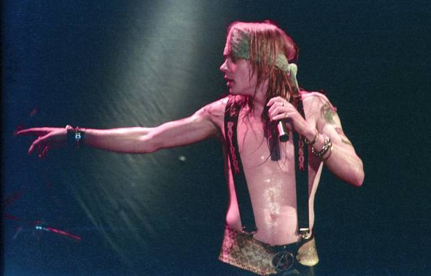 Axl Rose and the original Guns N' Roses, just as their career was taking off, on stage  at Perkin's Palace in Pasadena, CA on December 28, 1987.  Credit: Kevin Estrada / MediaPunch