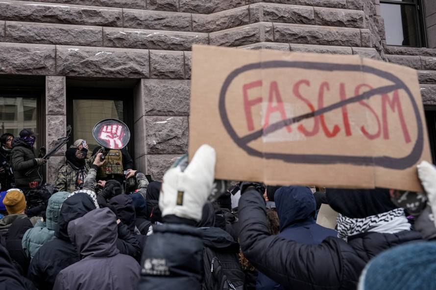 People attend the "March Against Minnesota Fraud" in Minneapolis