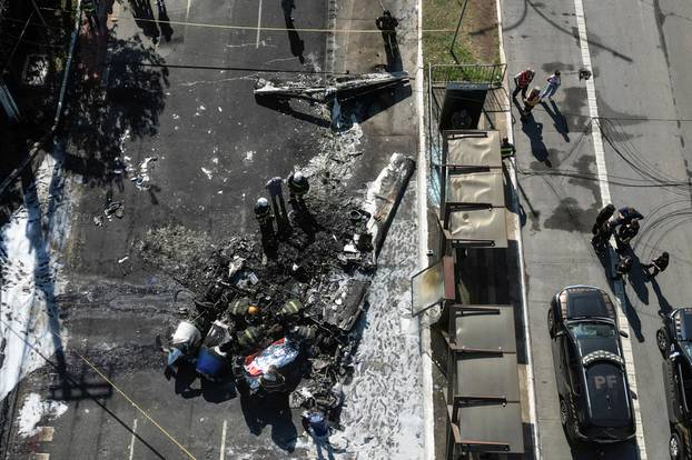Small plane crashes into vehicles on busy Sao Paulo avenue