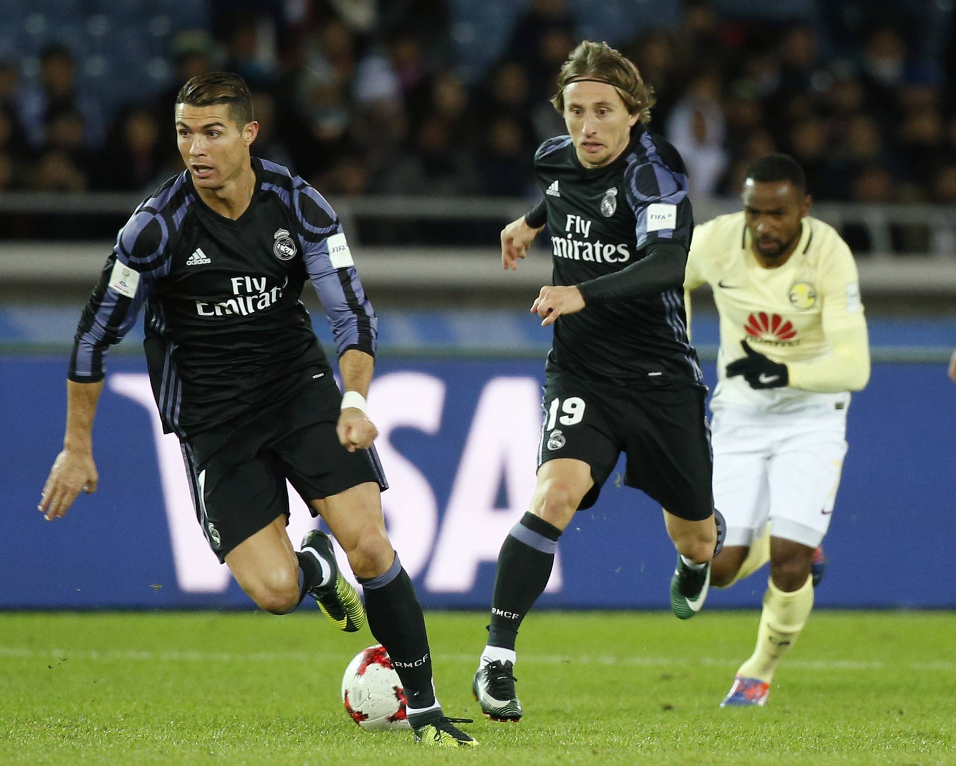 Real Madrid's Cristiano Ronaldo in action with Luka Modric