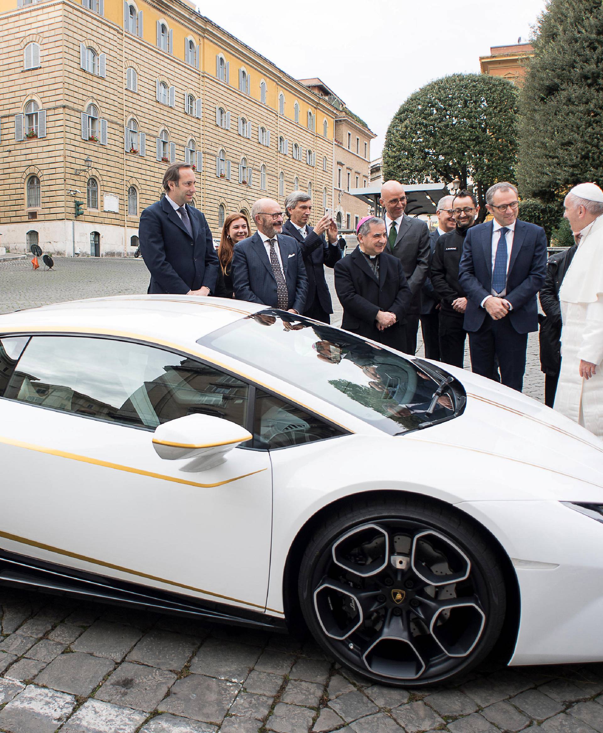 Pope Francis receives a Lamborghini Huracan prior to his Wednesday general audience in Saint Peter's square at the Vatican